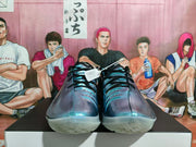 Front view of metallic aqua-teal basketball shoes showing black laces and translucent outsoles