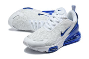 Angled view of white and blue Nike Air Max 270 Premium sneakers.