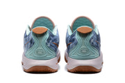 Rear view of the blue sneakers showing pale aqua heel details, white midsoles, and gum-colored outsole sections.