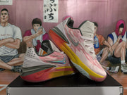 Angled side view highlighting the layered upper, side Swoosh, sculpted heel, and multicolor sole.