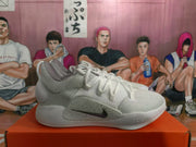 Side view of a white Nike basketball sneaker showing the Swoosh, textured upper, and visible “NIKE ZOOM” text.