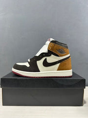 Side profile of the high-top sneaker with a brown collar and heel, black overlays, white midsole and burgundy outsole.