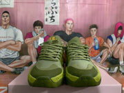 Front view of the sneaker pair showing tonal laces, layered toe panels and textured outsoles.