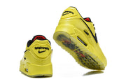 Heel and outsole views of yellow and black Nike Air Max 90 sneakers.