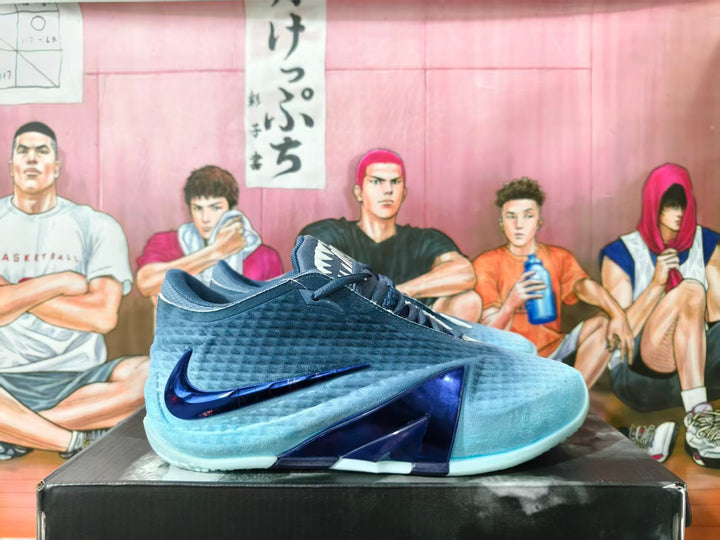 Side view of gray-blue Nike basketball shoes with dark blue Swoosh details