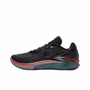 Black Nike GT Cut 2 sneaker with a red accent around the forefoot and a dark green and orange sculpted sole.