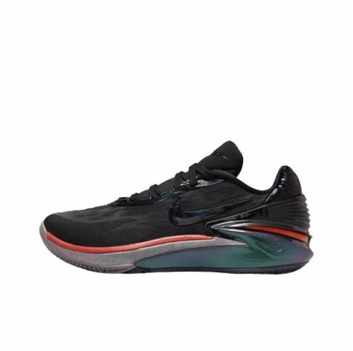 Black Nike GT Cut 2 sneaker with a red accent around the forefoot and a dark green and orange sculpted sole.