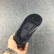 View of the black outsole showing its patterned traction sections and central logo area.