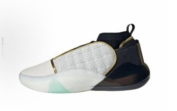 White and black high-top sneaker with a patterned side panel, rear pull tab and translucent outsole detail.