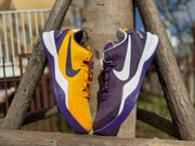 Purple and gold Kobe 8 shoes displayed side by side.