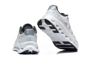Rear and outsole views showing the shoe branding and sculpted sole.