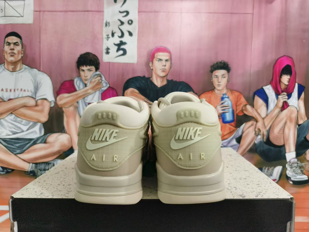 Rear view of beige Nike sneakers showing Nike Air heel branding.