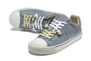 Angled view of the pair with contrasting laces and toe caps