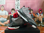 Pair of grey, black, and red sneakers shown from the side and rear.