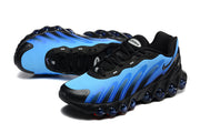 Pair of blue and black Nike Air Max DN8 sneakers in an angled top view.