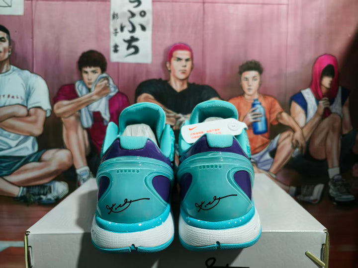 Rear view of sky blue and purple Nike basketball sneakers displayed on a shoebox.