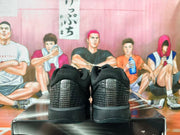 Rear view of black Nike basketball sneakers showing textured heel panels.