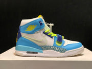 Side profile of the blue and white high-top sneaker with perforated toe and strap.