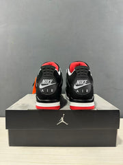 Rear view of the pair showing heel branding details, black uppers, white midsoles, and red outsole sections.