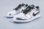 Pair of low-top silver and white sneakers with black laces, black side panels and translucent blue-tinted outsoles.
