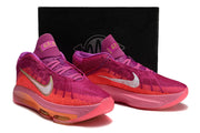 Pink and purple shoes displayed with a box.