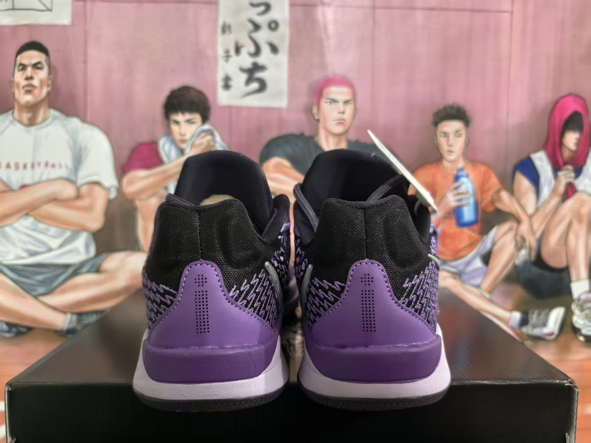 Rear view of black and purple Nike basketball sneakers showing the purple heel panels and layered soles.