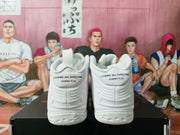 Rear view showing pull tabs and Comme des Garçons Homme Plus text on the heel.