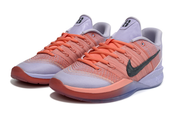 Pair of lavender and coral Nike Sabrina 3 shoes shown from the front