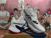 Angled side view of white ASICS METARISE volleyball shoes showing the side logo and high-cut collar