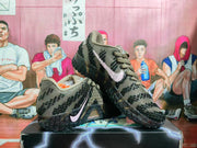 Angled view of the brown and black Nike sneakers showing both side swooshes, textured overlays, laces, and rugged black outsoles.