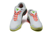 Pair of Nike 908-2 sneakers shown from the front in white, black, green, and coral.