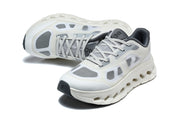 Pair of white and grey On Cloudtilt Remix sneakers in an angled view
