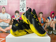 Angled view of the black-and-yellow basketball shoes resting on a box