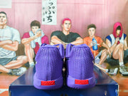 Rear view of purple Nike basketball shoes with red heel details