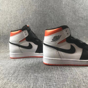 Rear three-quarter view of the pair showing the white heel panels, black Swooshes, and orange collars.