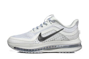 Side view of white and silver Nike Pegasus Premium running shoes with black Swoosh and visible Air Zoom branding.
