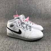 Pair of white and black high-top Jordan sneakers shown from a front three-quarter angle.