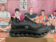 Side profile of a black On Cloudtilt sneaker showing textured panels and cutout sole