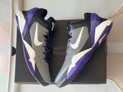 Top-down view showing the gray uppers, white Swoosh panels, and purple outsoles.