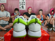 Rear view of the white basketball shoes showing fluorescent green padded collars and textured green outsoles.