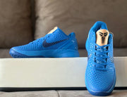Blue Kobe 6 shoes shown from the front, highlighting the tan tongue and Kobe logo.