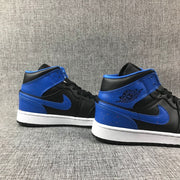 Pair of black and blue high-top sneakers shown from the rear-side angle.