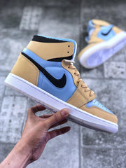 Side profile of the tan and light blue high-top sneaker with black Swoosh and layered panel construction.