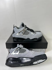 Air Jordan 4 Retro sneakers shown from an angled view, highlighting the mesh panels, sole, and outsole tread.