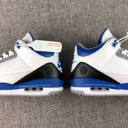 Side-by-side rear view of the pair showing matching black heel panels, blue midsoles, and visible air units.