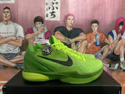 Side profile of a green Nike basketball sneaker showing the textured upper, black Swoosh, layered sole, and Zoom branding.