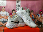 Angled view showing the side panels, perforations, and textured outsole of the Nike shoes.
