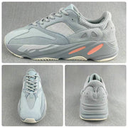 Collage showing side, top, and rear views of the gray and coral low-top sneakers.