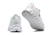 Rear and outsole views of white On Cloudmonster 3 shoes.