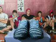 Front view of the pair showing matching blue laces, textured toe panels, and dark detailing.